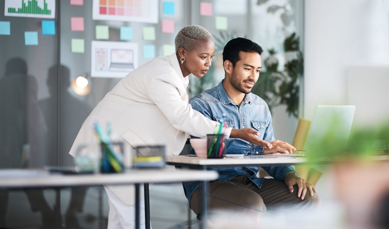 Company employees reviewing financial reports and disclosures before publishing to ensure transparency and ongoing reporting to stakeholders.